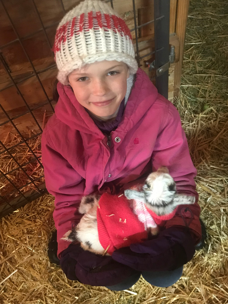 Kid with Baby Goat at Almosta Farm Cove Oregon